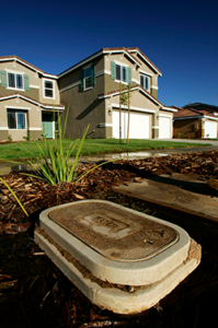 water line access point with house in background