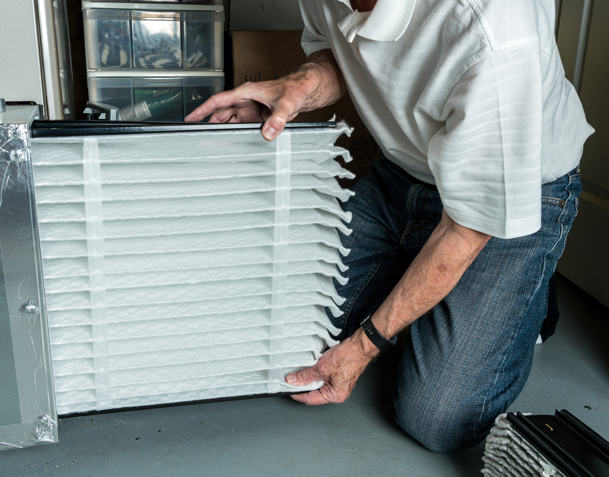 HVAC technician changing an air filter